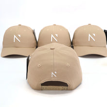The Beige and White Signature ‘N’ Baseball Cap