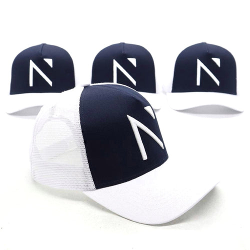 The White and Navy Signature ‘N’ Trucker Cap