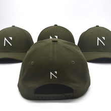 The khaki and White Signature ‘N’ Baseball Cap